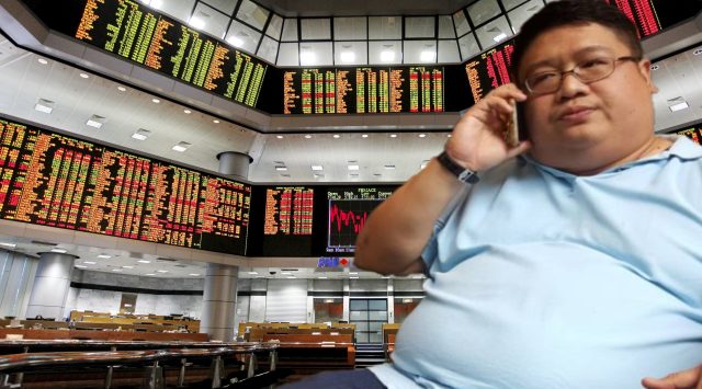 Yu Kuan Chon, chairman of Rapid Synergy Bhd, sits at a boardroom table as shareholders review the 2021 annual report containing undisclosed related party transactions.