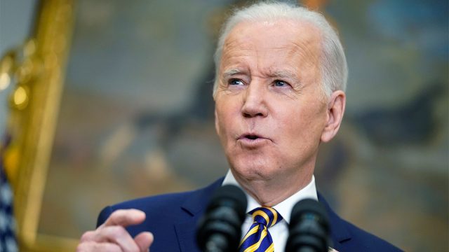 President Joe Biden speaks at a White House podium, announcing a ban on Russian energy imports over the Ukraine conflict.