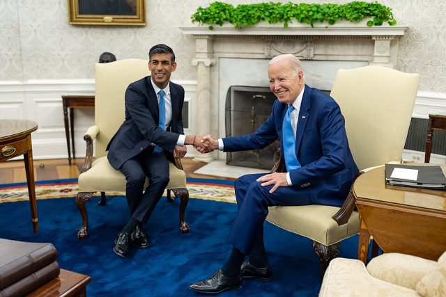 President Joe Biden and UK Prime Minister Rishi Sunak shake hands in the historic Oval Office during a diplomatic summit.