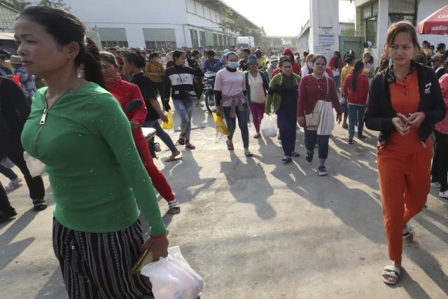 Workers exit a garment factory in Cambodia as EU contract cancellations trigger mass layoffs in the textile industry.