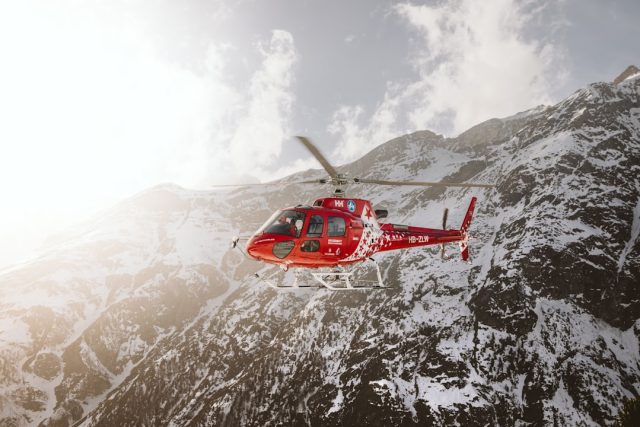 Mountain rescue teams search snow-covered slopes in the French Alps after two avalanches killed five skiers.