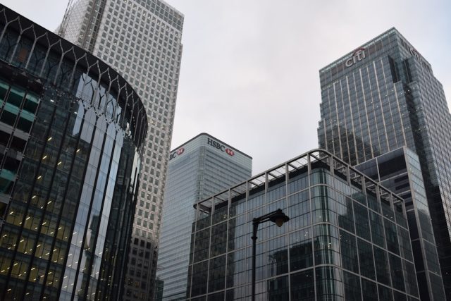 A Credit Suisse office building with a sign displaying the bank's name, symbolizing the financial institution at the center of the Mozambique tuna bond scandal.