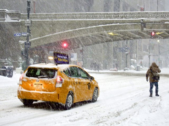 Snow-covered residential street with downed power lines after a severe winter storm