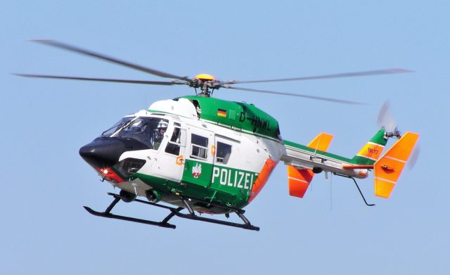 Rescue teams search a remote wooded crash site in Quebec near Baie-Johan-Beetz after a medical helicopter accident.