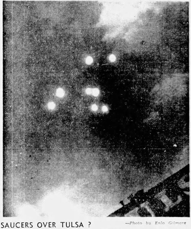 A declassified FBI document titled 62-HQ-83894 lies open on a desk, showing typed investigative records and redacted text about UFO sightings.
