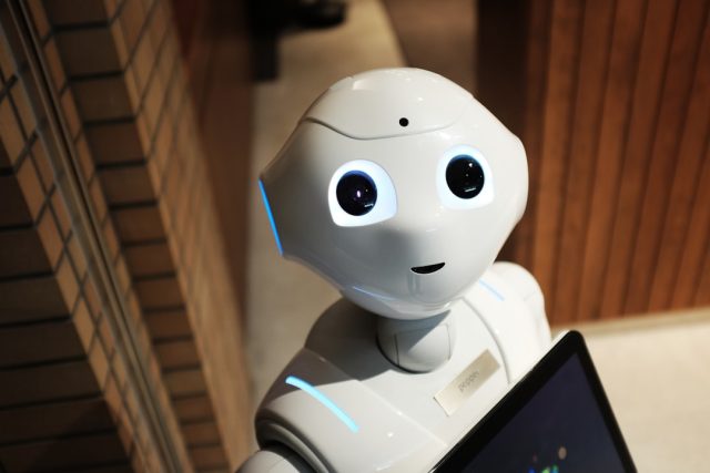 Vyom Mitra robot torso with silicone face and five-fingered hands sits inside a crew capsule at ISRO's Bengaluru facility.